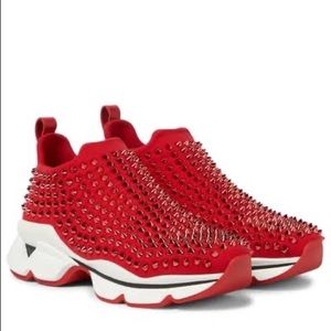 Red and white shoes with spikes